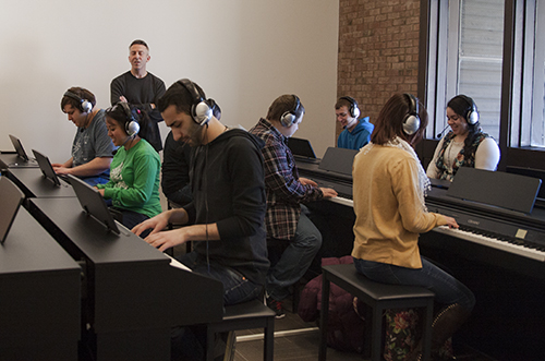 students learning piano
